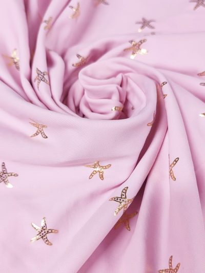 Lycra rosa estrellas de mar doradas