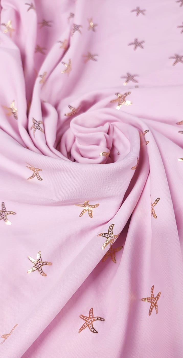 Lycra rosa estrellas de mar doradas